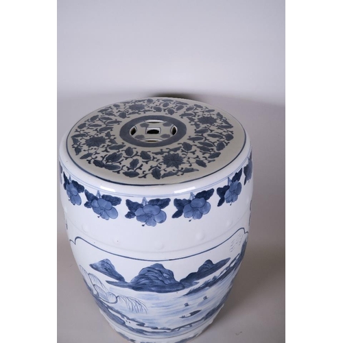 20 - A Chinese blue and white pottery garden seat decorated with a lake landscape, 17½