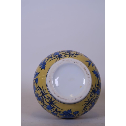 41 - A Chinese yellow ground porcelain vase with blue and white floral decoration, 12