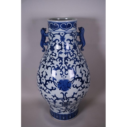 45 - A Chinese blue and white porcelain vase of baluster form with twin kylin handles decorated with flow... 