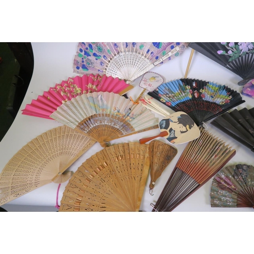 5 - A C19th bone and painted feather fan, together with a collection of Oriental bone, bamboo and paper ... 