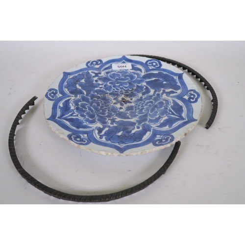 50H - A Chinese blue and white porcelain charger with foliate decoration and metal mounts, possibly Ching ... 