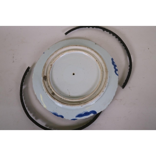 50H - A Chinese blue and white porcelain charger with foliate decoration and metal mounts, possibly Ching ... 