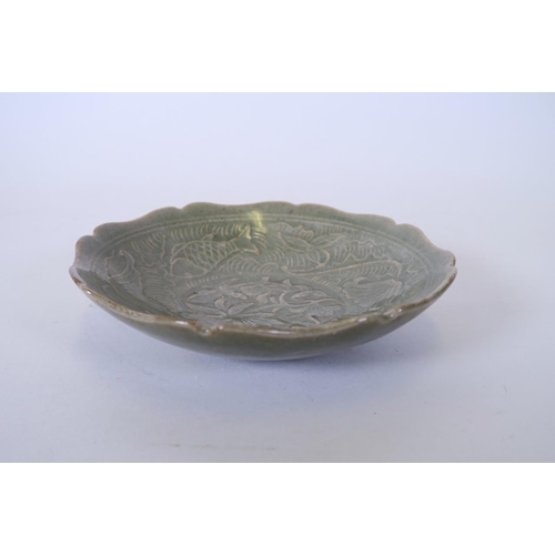 7 - A Chinese Song style olive glazed petal shaped dish with incised carp decoration, 6