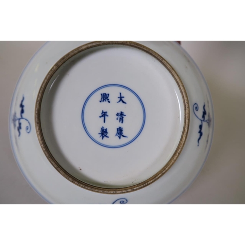 9 - A Chinese blue and white porcelain dish decorated with figures taking tea, 6 character mark to base,... 