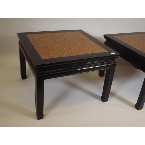 897 - A pair of Oriental lacquered occasional tables with inset cane tops, mid C20th