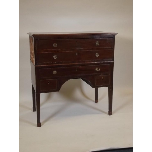 888 - A C19th inlaid mahogany kneehole secretaire, with fitted interior, raised on square tapering support... 