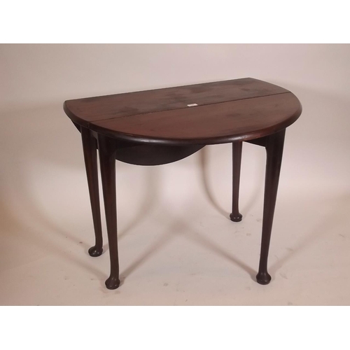 892 - A Georgian mahogany drop leaf table of small proportions, raised on pad feet, 35