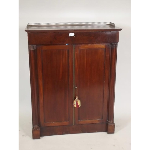 872 - A C19th mahogany side cabinet, with frieze drawer and two cupboards, the top with pierced brass gall... 