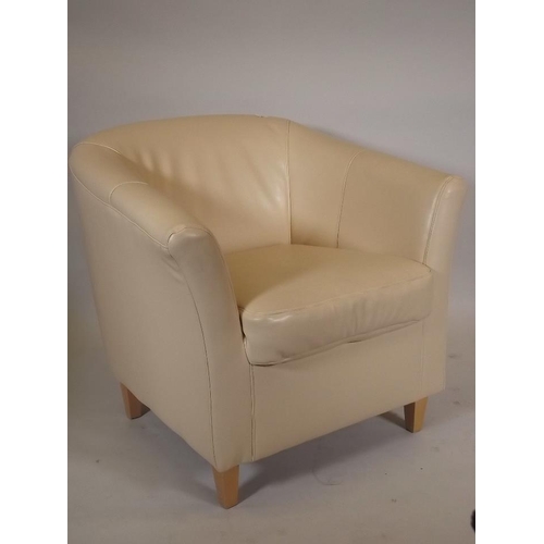 874 - A contemporary cream leatherette tub armchair