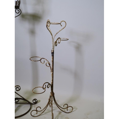 891 - A wrought iron adjustable urn stand and a four pot stand, 31