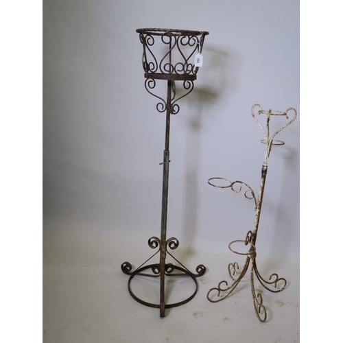 891 - A wrought iron adjustable urn stand and a four pot stand, 31