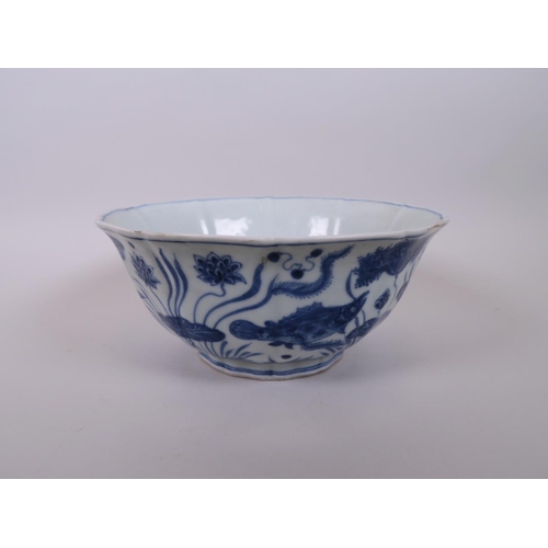 105 - A Chinese blue and white porcelain bowl of lobed form, decorated with carp in a lotus pond, 8