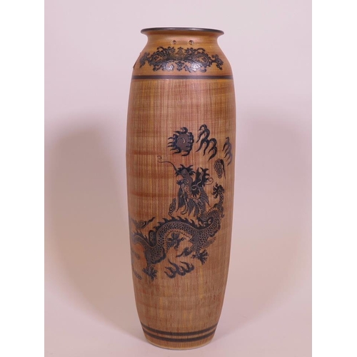 106 - An Oriental stoneware hanging vase, with sgraffito style glaze, and dragon decoration, 15