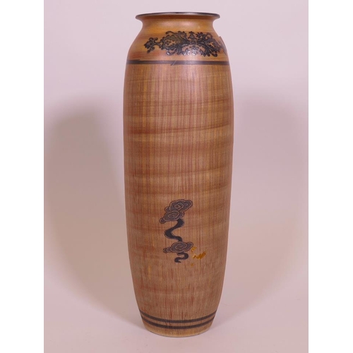 106 - An Oriental stoneware hanging vase, with sgraffito style glaze, and dragon decoration, 15