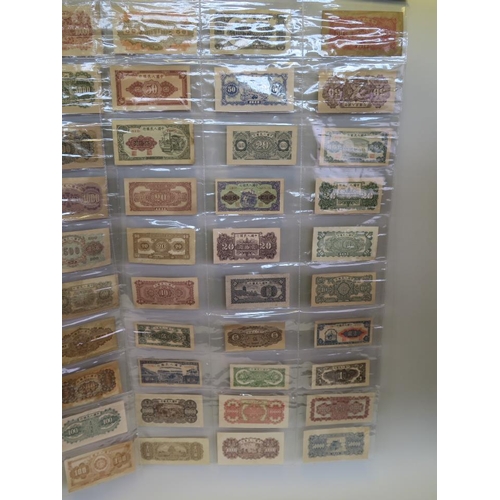 31 - A large quantity of Chinese facsimile (replica) bank notes, in two wall hanging wallets, largest not... 