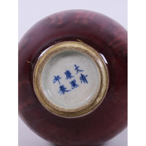 38 - A Chinese double gourd porcelain vase with slender neck and flambé glaze, 8