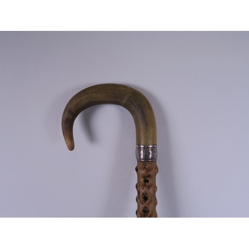 41 - A hedgerow walking stick with horn handle and white metal cuff, 32½