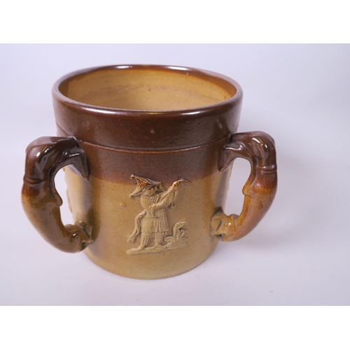 42 - A large C19th salt glazed stoneware tankard with four greyhound handles and embossed figure and tree... 