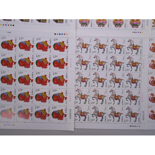 51 - A collection of twelve Chinese facsimile (replica) stamp sheets depicting animals of the zodiac, 7