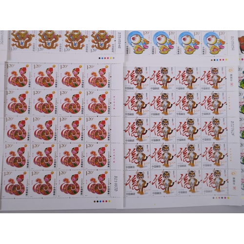 51 - A collection of twelve Chinese facsimile (replica) stamp sheets depicting animals of the zodiac, 7