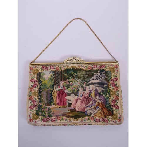 62 - A ladies petit point embroidered handbag decorated with a classical scene, bears label to interior '... 