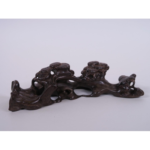 65 - A Chinese carved hardwood brush rest in the form of a tree root, 8