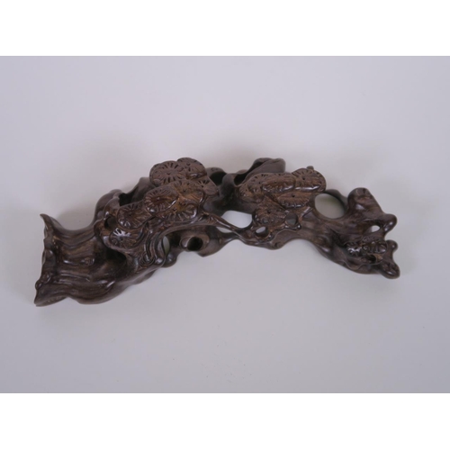 65 - A Chinese carved hardwood brush rest in the form of a tree root, 8