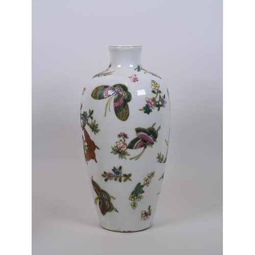 68 - A Chinese polychrome enamelled porcelain vase decorated with butterflies, seal mark to base, 10