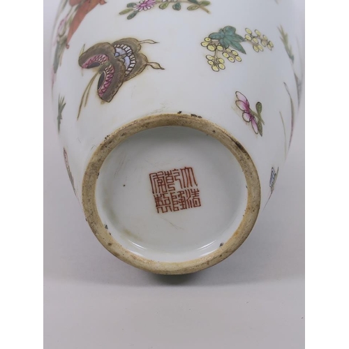 68 - A Chinese polychrome enamelled porcelain vase decorated with butterflies, seal mark to base, 10