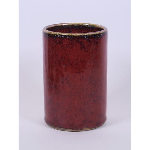 73 - A Chinese flambé glazed pottery brush pot, 5½