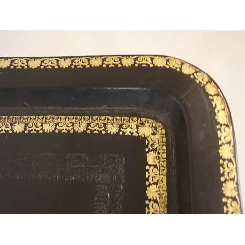 867 - A gilt tooled leather topped tray by Maitland Smith on an ebonised stand with ring turned supports, ... 