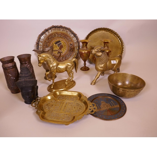 87 - A quantity of brass, including a figure of a bull, a horse, Oriental and Eastern trays etc