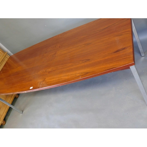 876 - A late C20th veneered and shaped top boardroom table of figured mahogany, raised on chromed supports... 