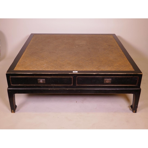 896 - An Oriental lacquered occasional table, with inset cane top and two push pull drawers, 44