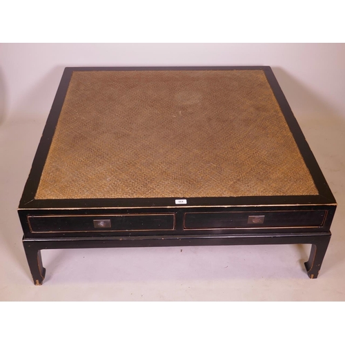 896 - An Oriental lacquered occasional table, with inset cane top and two push pull drawers, 44