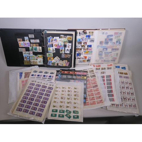 92 - A large quantity of British and world postage stamps, dating from the 1950s onwards, album mounted