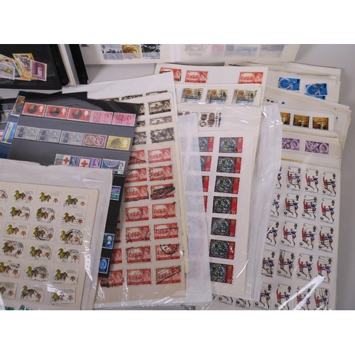 92 - A large quantity of British and world postage stamps, dating from the 1950s onwards, album mounted