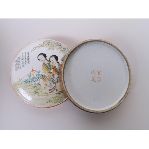 95 - A Chinese polychrome porcelain pot and cover, decorated with two women in a garden, four character m... 