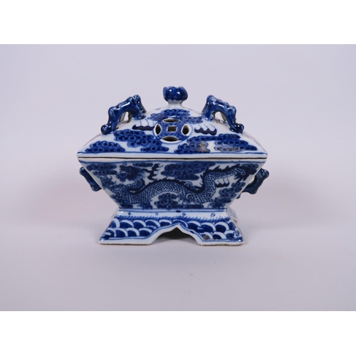 98 - A Chinese blue and white porcelain twin handled censer in the form of a chest, decorated with dragon... 