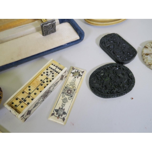 99 - A mixed lot, to include a miniature bone domino set, early C20th Cantonese ivory cheroot holders, op... 