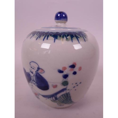 48 - An Oriental porcelain storage jar and cover decorated with figures in a continuous garden scene in b... 