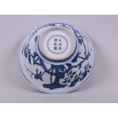 58 - A Chinese blue and white porcelain rice bowl decorated with animals in a landscape, 6 character mark... 