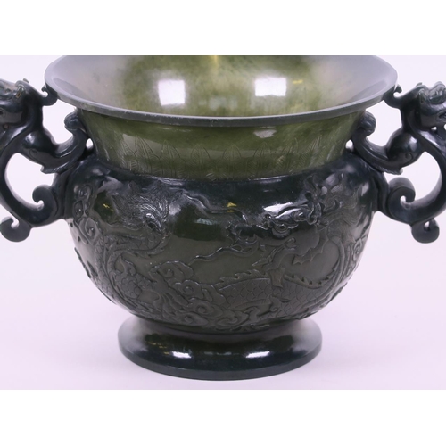 60 - A fine Chinese spinach jade two handled pot with carved dragon decoration, 5½