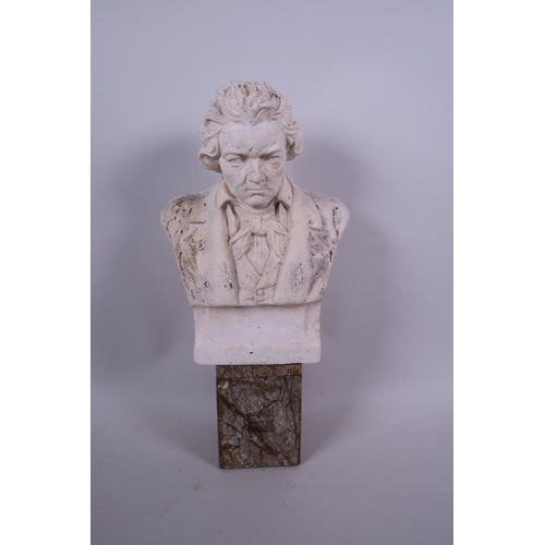 61 - A stoneware bust of Beethoven mounted on a marble socle, 12