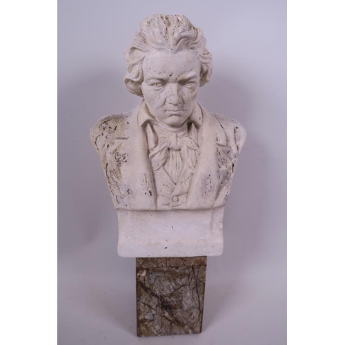 61 - A stoneware bust of Beethoven mounted on a marble socle, 12