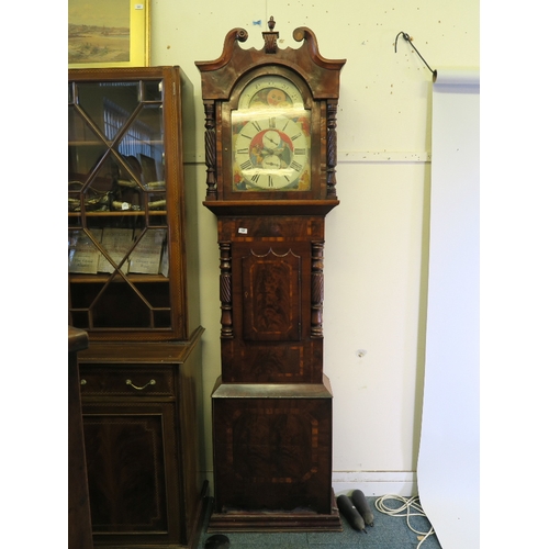 1210 - A C19th mahogany long case clock, with well figured veneered front, shaped door and carved twist col... 