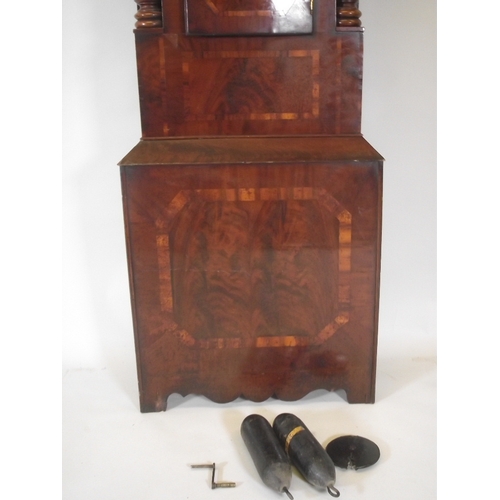 1210 - A C19th mahogany long case clock, with well figured veneered front, shaped door and carved twist col... 