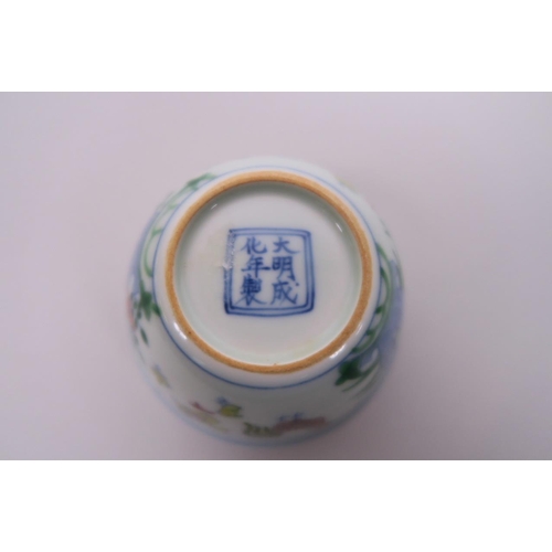 10 - A Chinese doucai porcelain tea bowl decorated with chickens, 6 character mark to base, 3