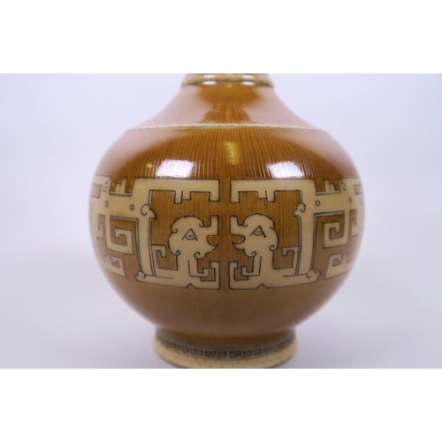 38 - A Chinese brown glazed garlic head shaped porcelain vase with archaic style decoration, seal mark to... 