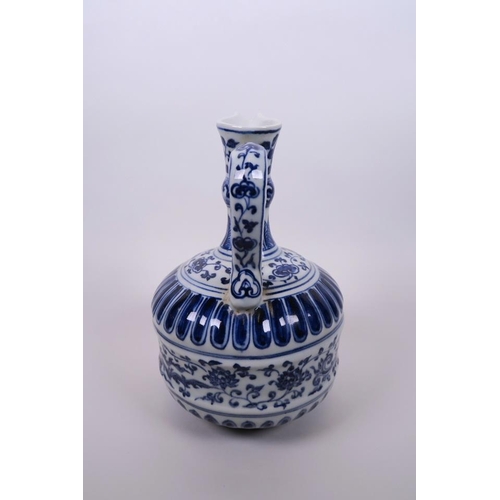 43 - A Chinese blue and white porcelain ewer, with ribbed body and painted phoenix and lotus flower decor... 